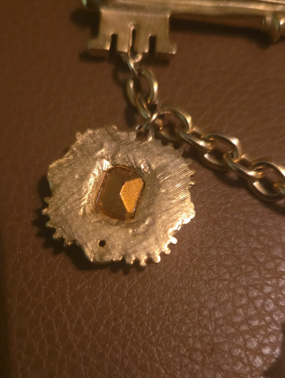 Gold-Tone Key & Charm Card Holder Accent with Green Gem and Cross Pendant